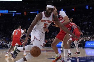 Kyshawn George (à droite) tente de s'interposer devant Precious Achiuwa. KEYSTONE/AP/Pamela Smith